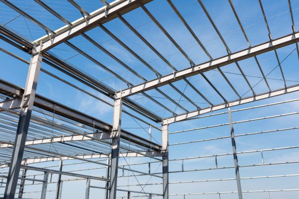 steel frame building closeup against a blue sky